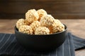 Tasty puffed rice balls in bowl on table, closeup Royalty Free Stock Photo