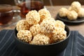 Tasty puffed rice balls in bowl on table, closeup Royalty Free Stock Photo