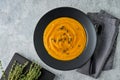 Tasty pumpkin creamy puree soup with seeds and thyme. Horizontal, top view, copy space Royalty Free Stock Photo