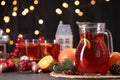 Tasty punch drink and Christmas decor on grey table Royalty Free Stock Photo