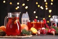 Tasty punch drink and Christmas decor on grey table Royalty Free Stock Photo