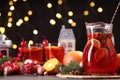 Tasty punch drink and Christmas decor on grey table Royalty Free Stock Photo