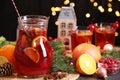 Tasty punch drink and Christmas decor on grey table Royalty Free Stock Photo