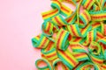 Tasty rainbow sour belts on pink background, top view. Space for text Royalty Free Stock Photo