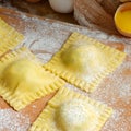 Tasty raw ravioli with ricotta and spinach, with flour and eggs on wooden background. Process of making italian ravioli. Royalty Free Stock Photo