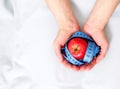 Tasty red apple and tape measure representing slimming and weight loss Royalty Free Stock Photo