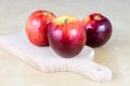 Tasty and ripe apples. Fruit sprinkled with water on a wooden kitchen table. Royalty Free Stock Photo