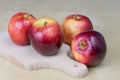 Tasty and ripe apples. Fruit sprinkled with water on a wooden kitchen table. Royalty Free Stock Photo