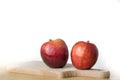 Tasty and ripe apples. Fruit sprinkled with water on a wooden kitchen table. Royalty Free Stock Photo