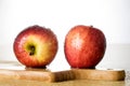 Tasty and ripe apples. Fruit sprinkled with water on a wooden kitchen table. Royalty Free Stock Photo