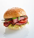 Tasty roast beef or pastrami burger with rocket Royalty Free Stock Photo