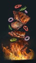 Tasty roasted meat and vegetables falling on barbecue grill with burning fire against background Royalty Free Stock Photo