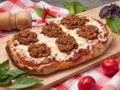 Roman pizza bolognese on a wooden board