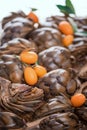 Tasty roman style backed artichokes with Kumquat, close up