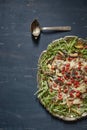 Tasty salad with eggplant wedges, rucola, wild strawberries and Royalty Free Stock Photo