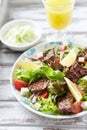Tasty Salad with Grilled Beef Pieces, Cherry Tomatoes, feta Cheese and Kalamata Olives