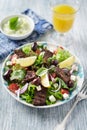 Tasty Salad with Grilled Beef Pieces, Cherry Tomatoes, feta Cheese and Kalamata Olives