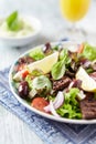 Tasty Salad with Grilled Beef Pieces, Cherry Tomatoes, feta Cheese and Kalamata Olives