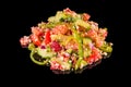 Tasty salad with tomatoes, cucumber, quinoa, cheese and green pepper with reflection