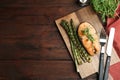 Tasty salmon steak served with asparagus and sprouts on wooden table. Space for text Royalty Free Stock Photo
