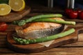 Tasty salmon steak served with asparagus on table Royalty Free Stock Photo