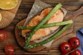 Tasty salmon steak served with asparagus on table, flat lay Royalty Free Stock Photo