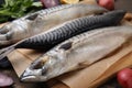 Tasty salted mackerels on table, closeup view