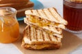 Tasty sandwiches with apricot jam and peanut butter for breakfast on table, closeup Royalty Free Stock Photo