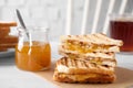 Tasty sandwiches with apricot jam and butter for breakfast on white table Royalty Free Stock Photo