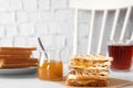 Tasty sandwiches with apricot jam and butter for breakfast on white table Royalty Free Stock Photo