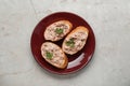 Tasty sandwiches with cod liver on light grey table, top view