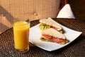 Tasty sandwiches with meat and vegetables, the sweet juice from oranges.