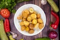 Tasty sauteed potatoes with garlic and spices on a plate