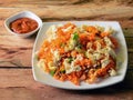 Tasty Schezwan Egg fried rice with tomato sauce served in white plate over a rustic wooden background, Indian cuisine, selective Royalty Free Stock Photo