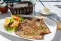 Tasty seafood, grilled tuna fish steaks served on outdoor terrace on Puerto Naos, La Palma, Canary islands, Spain