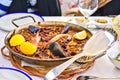 Tasty Seafood Paella in black pan -traditional spanish rice dish Royalty Free Stock Photo