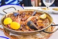 Tasty Seafood Paella in black pan -traditional spanish rice dish Royalty Free Stock Photo