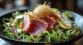 Tasty seared tuna tataki salad with fresh veggies, crispy fried onions, and a delicious vinaigrette for a nutritious and delicious