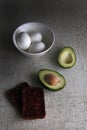 Tasty seeds-bread and sandwich slices with avocado and poached eggs on the bowl. Healthy nutrition. delicious breakfast or lunch Royalty Free Stock Photo