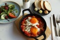 Tasty Shakshouka served on white marble table, above view Royalty Free Stock Photo