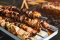 Tasty shashlik, outdoors. Cooking of pork meat. Barbecue lunch outdoors.Shashlik prepared on barbecue grill over charcoal. Grillin