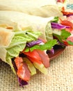 Tasty shawarma with fresh vegetables and meat, lavash, pita, ap