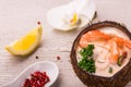 Tasty Shrimp soup with coconut milk, kaffir lime leaves, galangal, chilli and lemon grass in a coconut Royalty Free Stock Photo