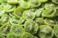 Tasty slices of kiwi as background, closeup. Royalty Free Stock Photo