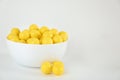 Tasty small lemon drops on background