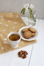 A tasty snack: a cup of tea and a plate of cookies Royalty Free Stock Photo