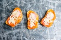 Tasty snack on gray background with copy space, flat lay, appetizing hot sandwiches with crispy crust, with spicy sauce Royalty Free Stock Photo