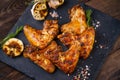 Tasty spiced grilled chicken wings. Beer snack Royalty Free Stock Photo