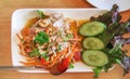 Tasty spicy thai glass noodle salad with pork top view on white plate