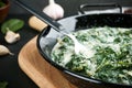 Tasty spinach dip in frying pan on table Royalty Free Stock Photo